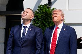 Trump greets President Karol Nawrocki of Poland on the South Portico of the White House