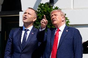 Trump greets President Karol Nawrocki of Poland on the South Portico of the White House