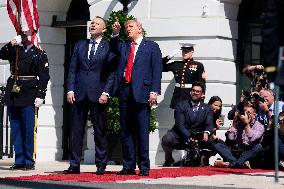 Trump greets President Karol Nawrocki of Poland on the South Portico of the White House