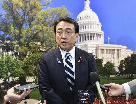 Japan economic revitalization minister in Washington