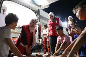Syrian Red Crescent Volunteers Training Children In First Aid At Damascus International Fair