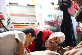 Syrian Red Crescent Volunteers Training Children In First Aid At Damascus International Fair