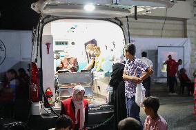 Syrian Red Crescent Volunteers Training Children In First Aid At Damascus International Fair