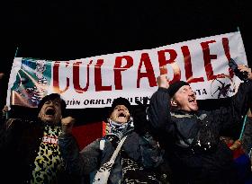 Supporters Hold Masks of Former President Alvaro Uribe During Trial in Bogota