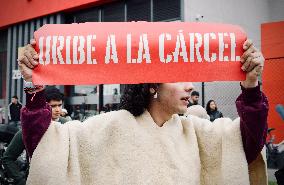 Supporters Hold Masks of Former President Alvaro Uribe During Trial in Bogota