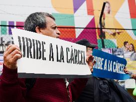 Supporters Hold Masks of Former President Alvaro Uribe During Trial in Bogota