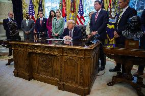 DC: President Trump Signs a Presidential Memorandum in Oval Office