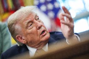 DC: President Trump Signs a Presidential Memorandum in Oval Office