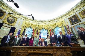 DC: President Trump Signs a Presidential Memorandum in Oval Office