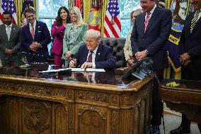 DC: President Trump Signs a Presidential Memorandum in Oval Office