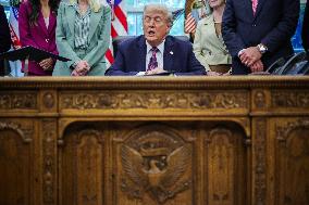 DC: President Trump Signs a Presidential Memorandum in Oval Office
