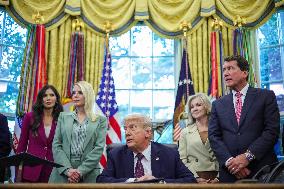 DC: President Trump Signs a Presidential Memorandum in Oval Office