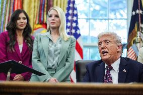 DC: President Trump Signs a Presidential Memorandum in Oval Office