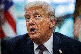 DC: President Trump Signs a Presidential Memorandum in Oval Office