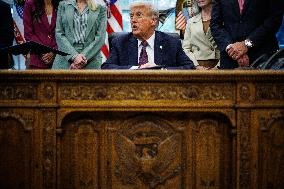DC: President Trump Signs a Presidential Memorandum in Oval Office