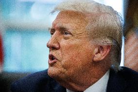 DC: President Trump Signs a Presidential Memorandum in Oval Office