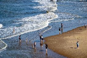 Beachgoers Enjoy Late Summer Warm Weather - Netherlands