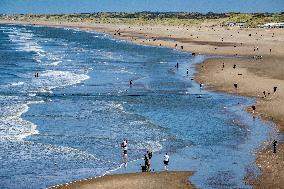 Beachgoers Enjoy Late Summer Warm Weather - Netherlands