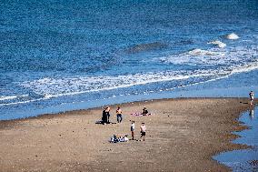 Beachgoers Enjoy Late Summer Warm Weather - Netherlands