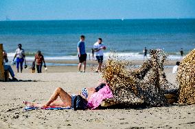 Beachgoers Enjoy Late Summer Warm Weather - Netherlands