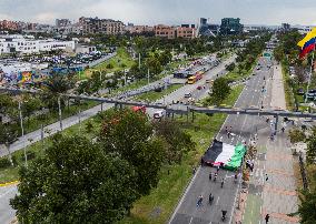 Pro-Palestine Demonstrators Carry Flag Across Bogota