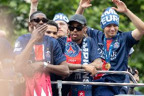 Supporters cheer the PSG in a parade in Paris - AJ