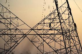 Workers Are Installing a High-Voltage Electricity Pylon - India