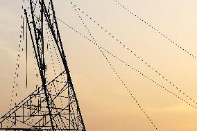Workers Are Installing a High-Voltage Electricity Pylon - India