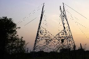 Workers Are Installing a High-Voltage Electricity Pylon - India