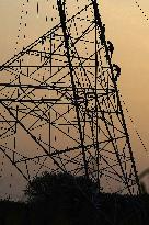 Workers Are Installing a High-Voltage Electricity Pylon - India