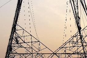 Workers Are Installing a High-Voltage Electricity Pylon - India