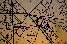 Workers Are Installing a High-Voltage Electricity Pylon - India