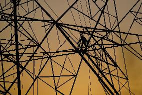 Workers Are Installing a High-Voltage Electricity Pylon - India