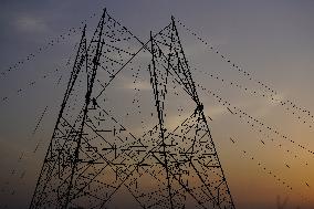 Workers Are Installing a High-Voltage Electricity Pylon - India