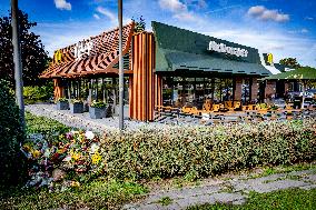 Flowers At McDonald's Where 15-Year-Old Was Killed By Police - Netherlands