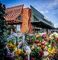 Flowers At McDonald's Where 15-Year-Old Was Killed By Police - Netherlands