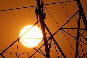 Workers Are Installing a High-Voltage Electricity Pylon - India