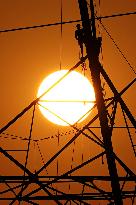 Workers Are Installing a High-Voltage Electricity Pylon - India