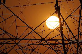 Workers Are Installing a High-Voltage Electricity Pylon - India
