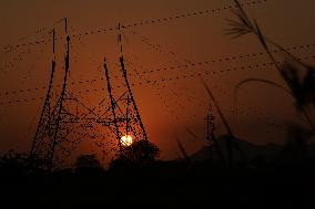 Workers Are Installing a High-Voltage Electricity Pylon - India