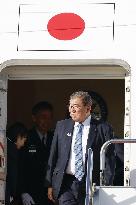 Japan PM returns home