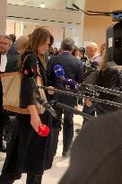 Carla Bruni Grabs The Windscreen Of A Mediapart Microphone