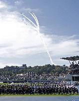 Blue Impulse aerobatic team flies over sports festival venue