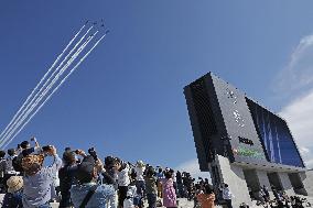 Blue Impulse aerobatic team flies over sports festival venue