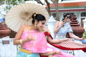 Tourists in Thai Traditional Costumes - Bangkok