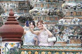 Tourists in Thai Traditional Costumes - Bangkok