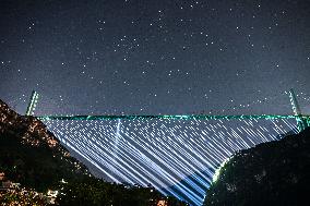 Huajiang Grand Canyon Bridge At Night - China