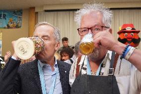 Prime Minister Taps Keg At Oktoberfest - Canada