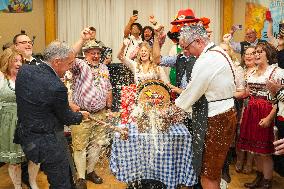 Prime Minister Taps Keg At Oktoberfest - Canada