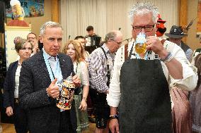 Prime Minister Taps Keg At Oktoberfest - Canada